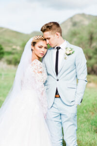 Bride and groom portrait with mountain backdrop at Kimball Home estate wedding in Utah