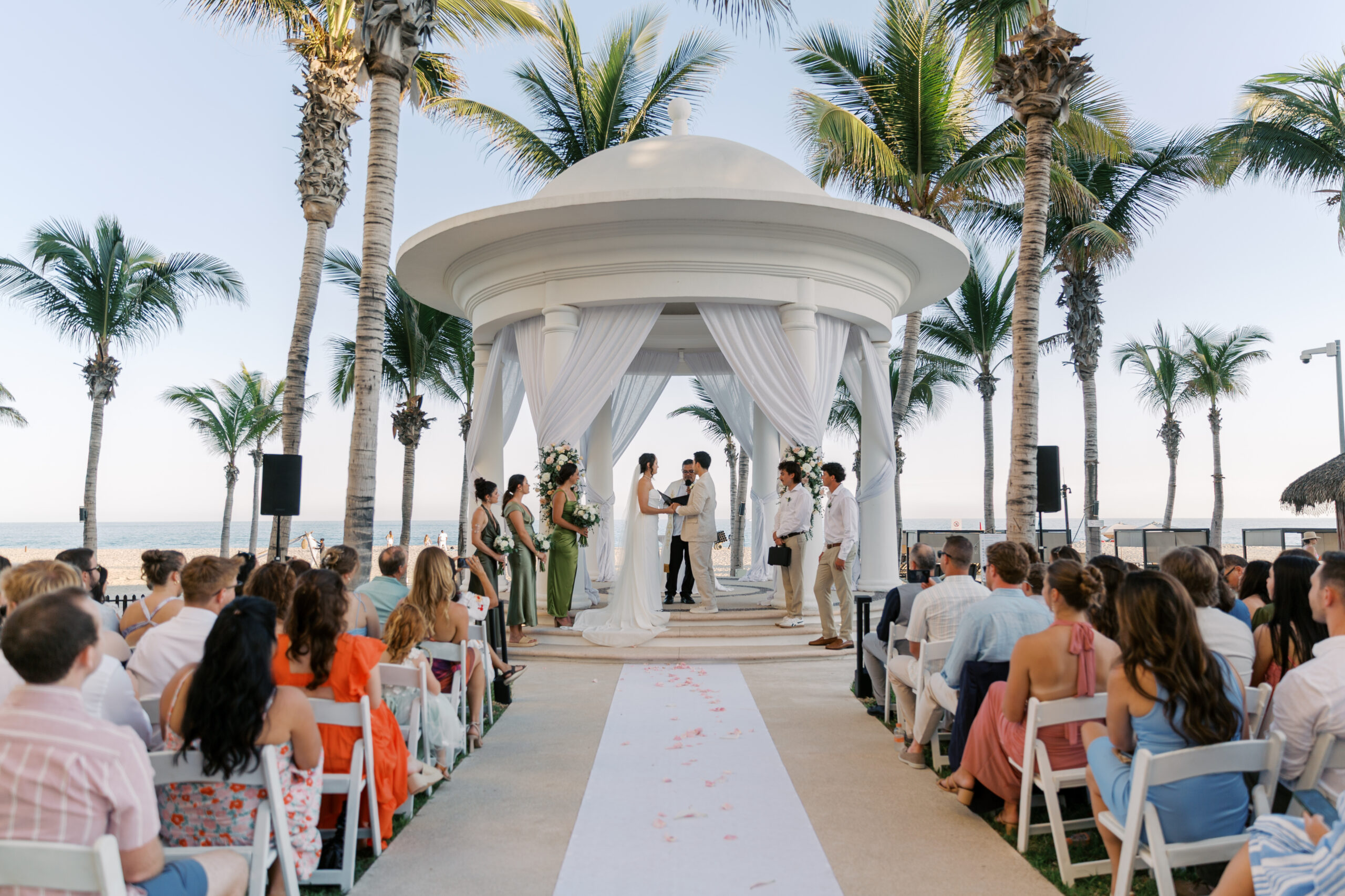 Beachfront wedding ceremony at Hyatt Ziva Los Cabos in Cabo San Lucas, Mexico with palm-lined gazebo and ocean views