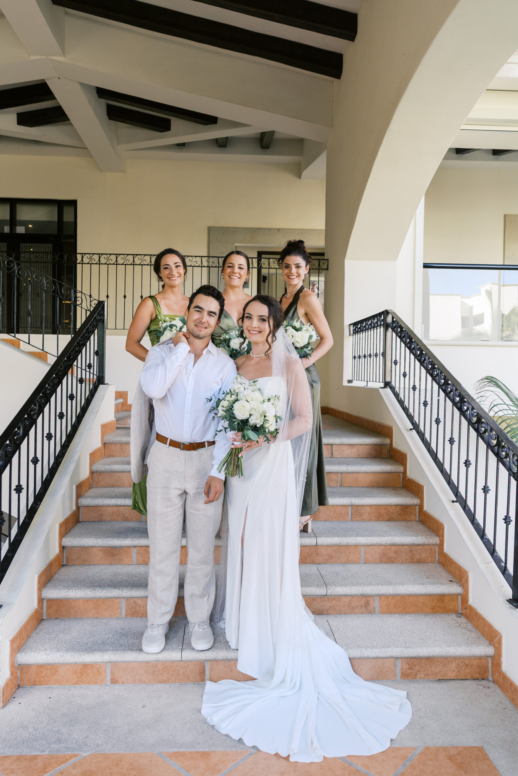Bride and groom with bridesmaids at Hyatt Ziva Los Cabos during a destination wedding in Cabo San Lucas